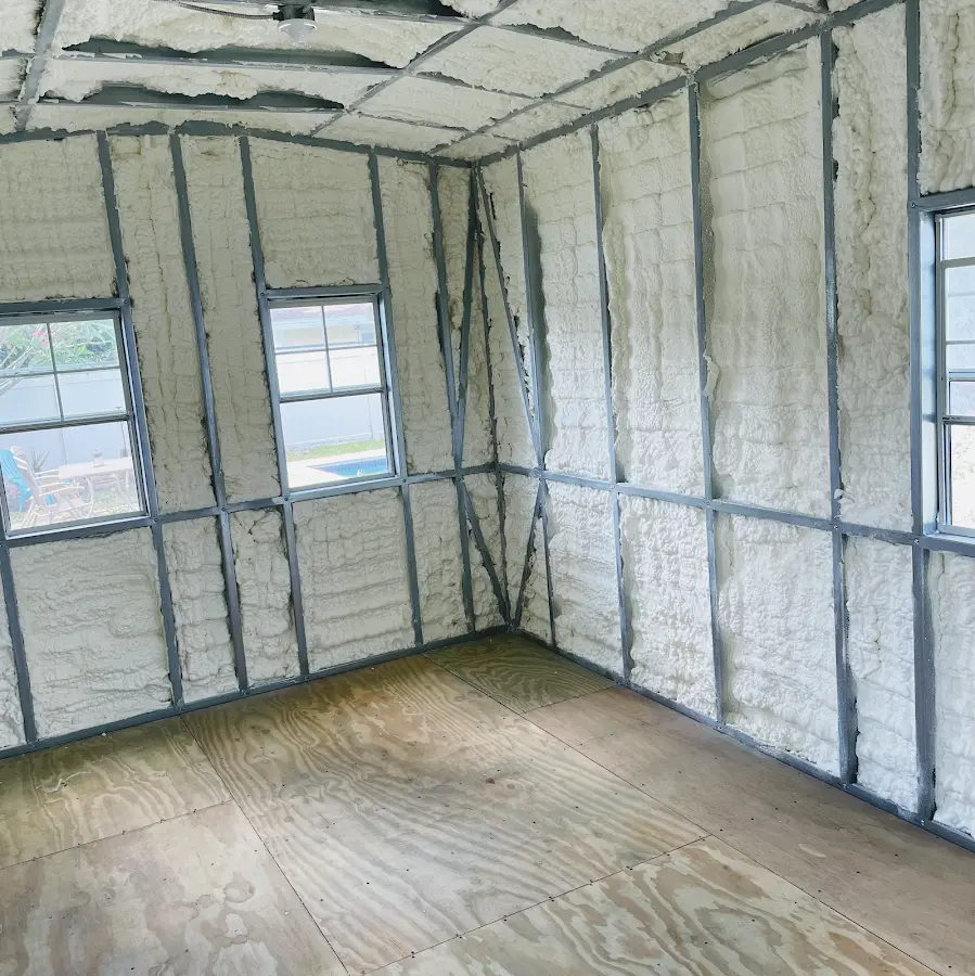Closed-cell spray foam insulation applied to wall cavities in a residential project in Ravenna